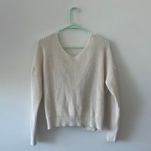 Sweater with knot tied in the back
